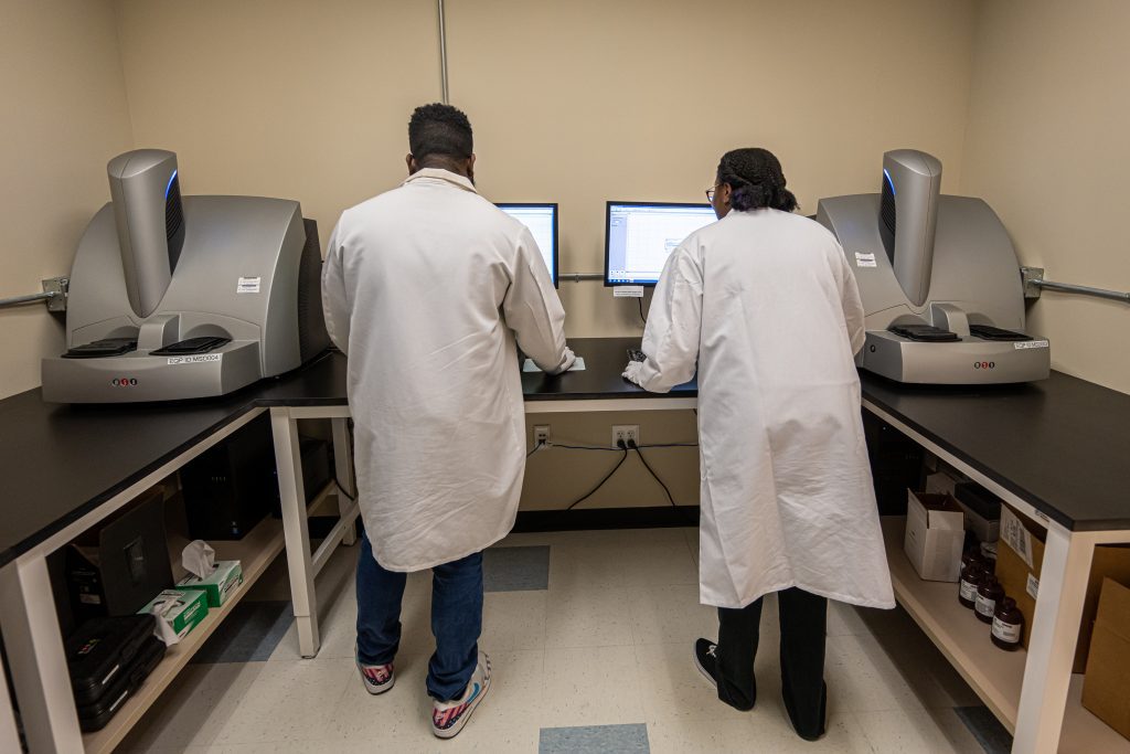 Two scientists using equipment