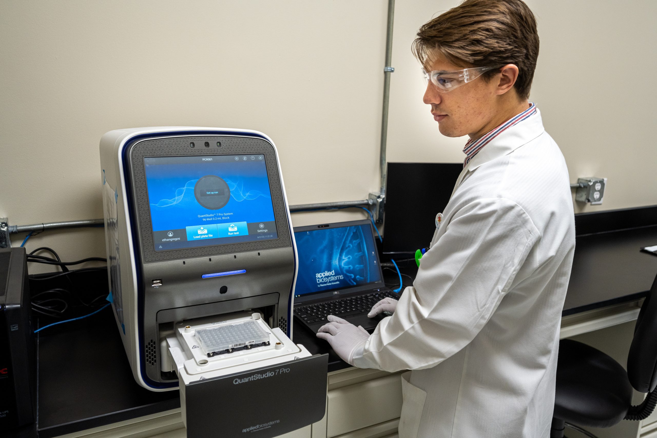 Scientist using QuantStudio equipment