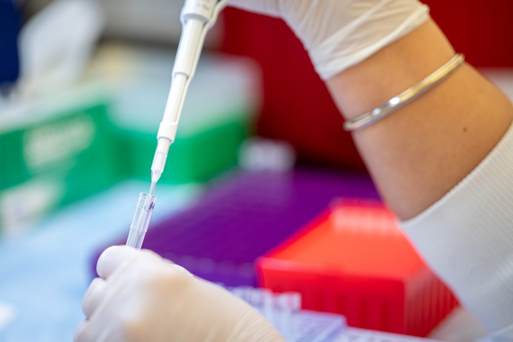 Scientist filling pipette